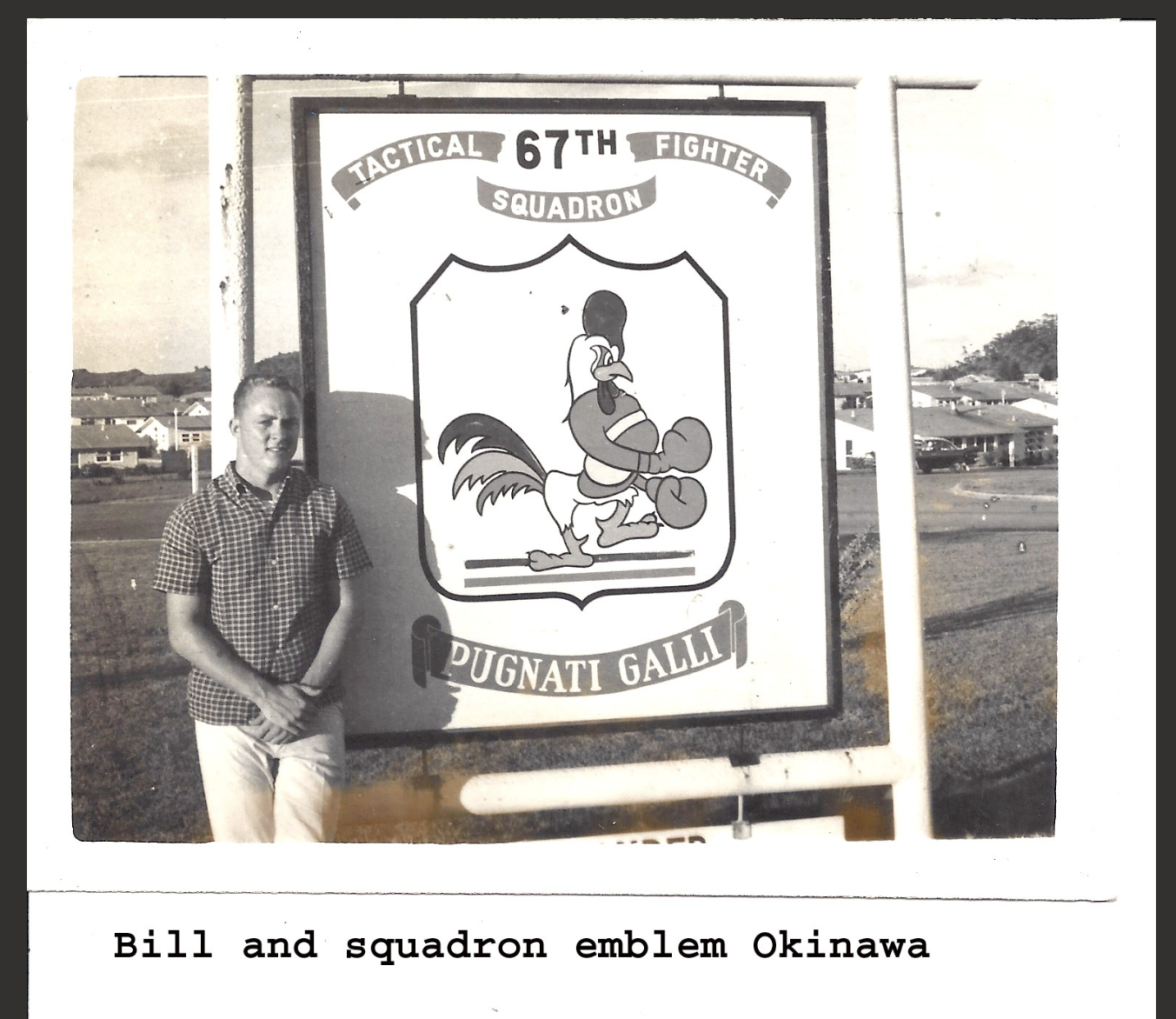 Bill at his bench, tools and plaques around him